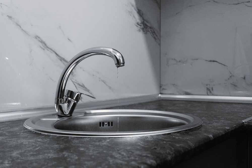 A dripping kitchen faucet — a common source of hidden water waste